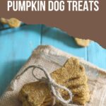Pumpkin dog treat biscuits stacked on burlap with text overlay.