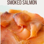 Smoked salmon piled on a plate with text overlay.