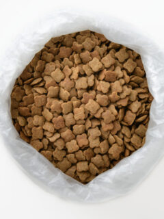 A bag of dog treats on a white background.