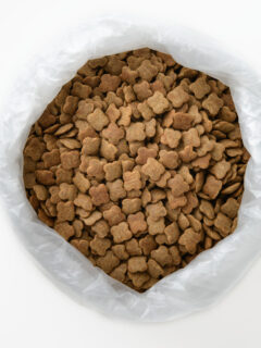 A bag of dog food on a white background.