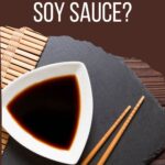 Bowl of soy sauce with chopsticks next to it. Text overlay that says: "can dogs eat soy sauce?"