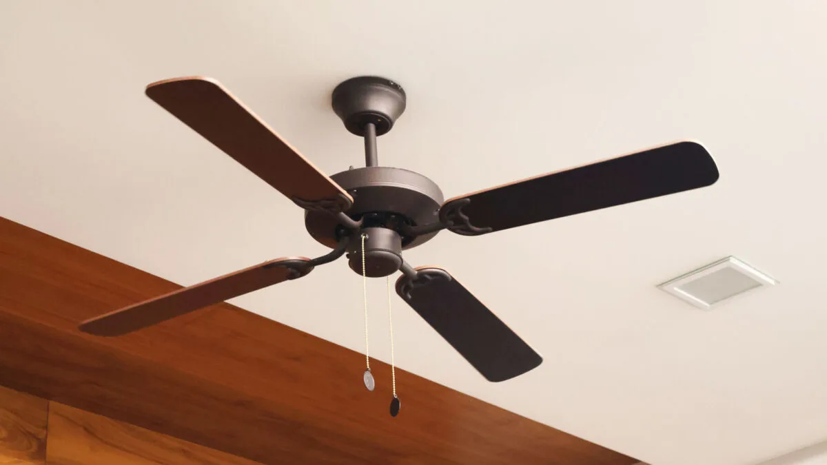 Wooden ceiling fan. Modern room cooling device with speed control.