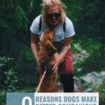 A smiling person kneels to pet a happy dog on a forest trail. Text above reads, “9 Reasons Dogs Make Better Companions Than Cats.” Subtle hints in the scene echo the idea of “9 ways your dog shows you’re their favorite person.” Website URL is shown at the top.